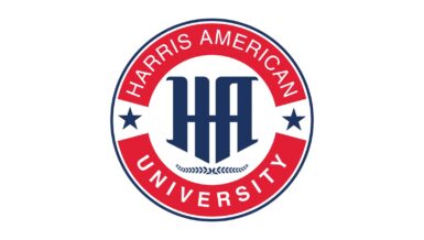 Round red, white and navy Harris American University emblem with the HA monogram, two stars and a laurel branch
