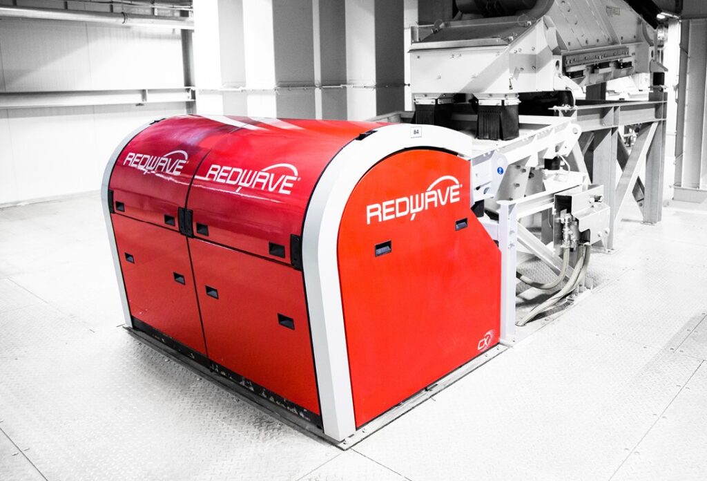 Red REDWAVE optical sorting machine installed in a recycling plant