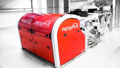 Red REDWAVE optical sorting machine installed in a recycling plant
