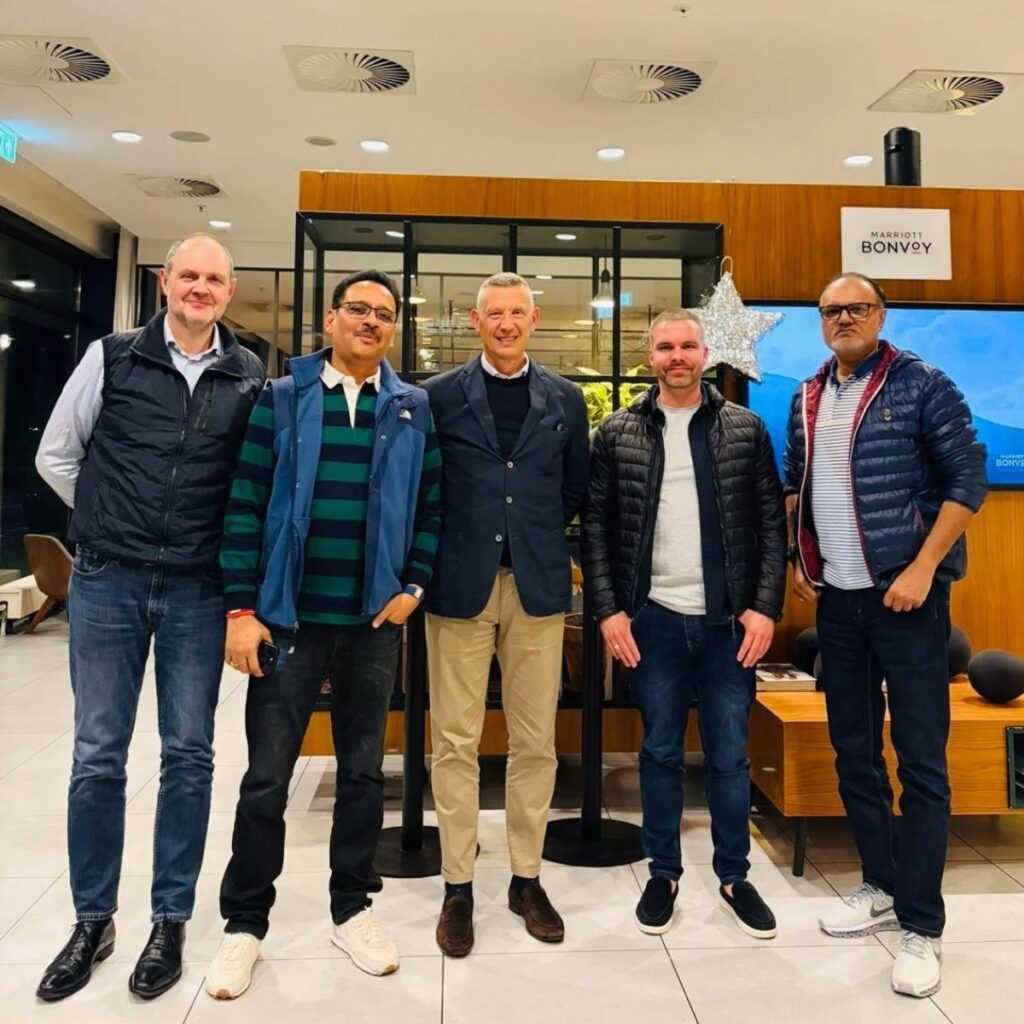 Five men from the SOREMA and Indorama Ventures management teams standing side by side in a hotel lounge after agreeing on the food-grade PET recycling plant for Lagos, Nigeria