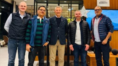 Five men from the SOREMA and Indorama Ventures management teams standing side by side in a hotel lounge after agreeing on the food-grade PET recycling plant for Lagos, Nigeria